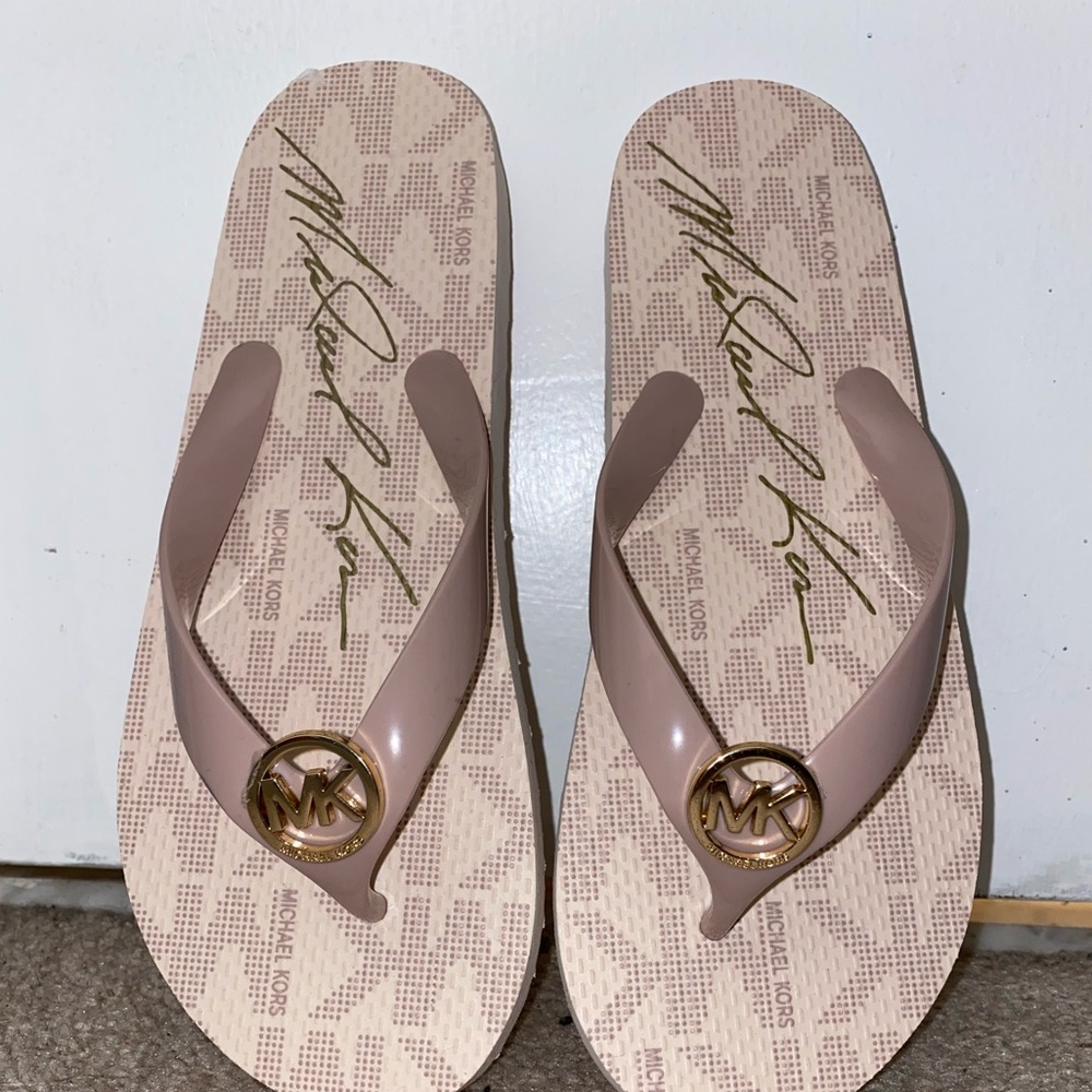 Light Pink Michael Kors Flip Flops. Never worn.